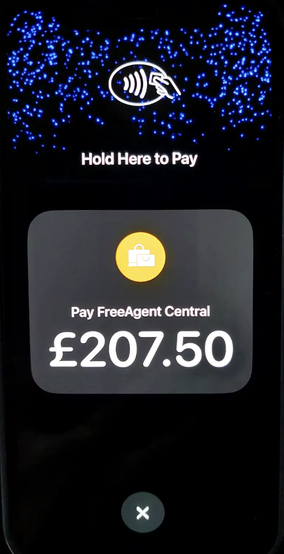 Tap to Pay screen instructing to 'Hold card'.