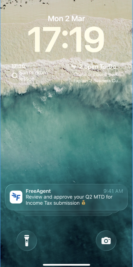 Mobile home screen showing notification to approve a quarterly update submission in FreeAgent.